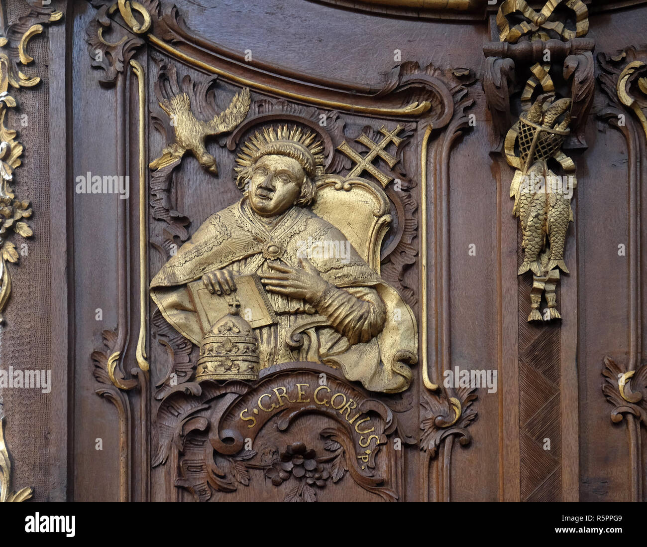 Saint Gregory the Great, one of the Latin Fathers of the Church, choir stalls by Daniel Aschauer in Cistercian Abbey of Bronbach in Reicholzheim near  Stock Photo