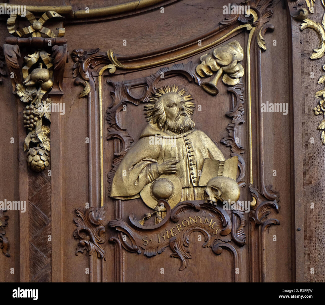 Saint Jerome, one of the Latin Fathers of the Church, choir stalls by Daniel Aschauer in Cistercian Abbey of Bronbach in Reicholzheim near Wertheim, G Stock Photo
