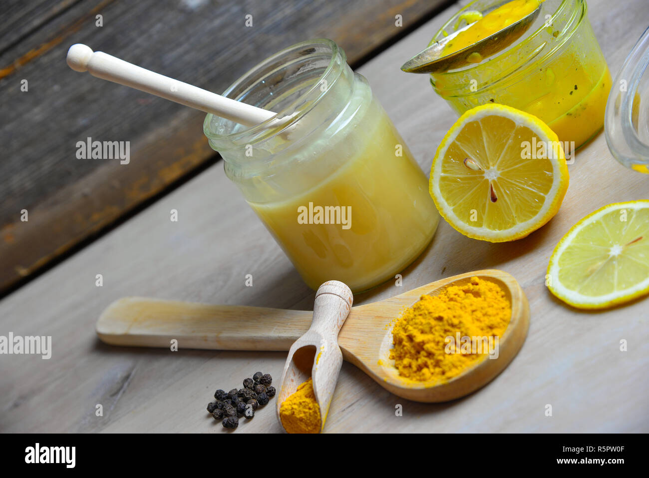 homemade natural antibiotic with honey golden honey turmeric Stock