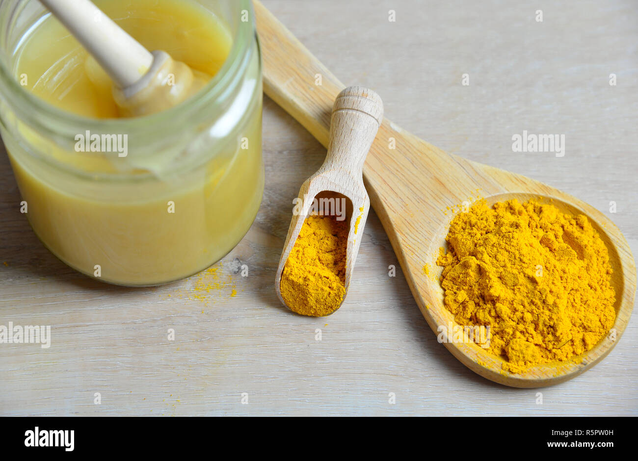 homemade natural antibiotic with honey golden honey turmeric Stock