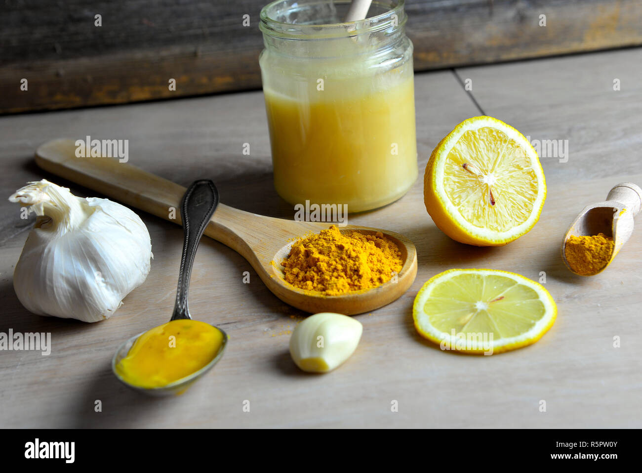 homemade natural antibiotic with honey golden honey turmeric Stock