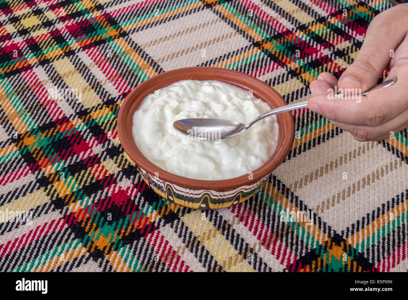 Eating a traditional bulgarian yogurt from a bowl Stock Photo
