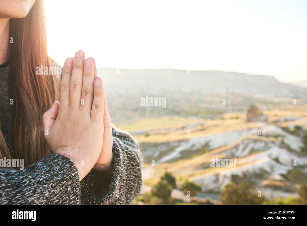 A girl practices yoga or meditation or searching for a soul. Solitude and unplugged Stock Photo