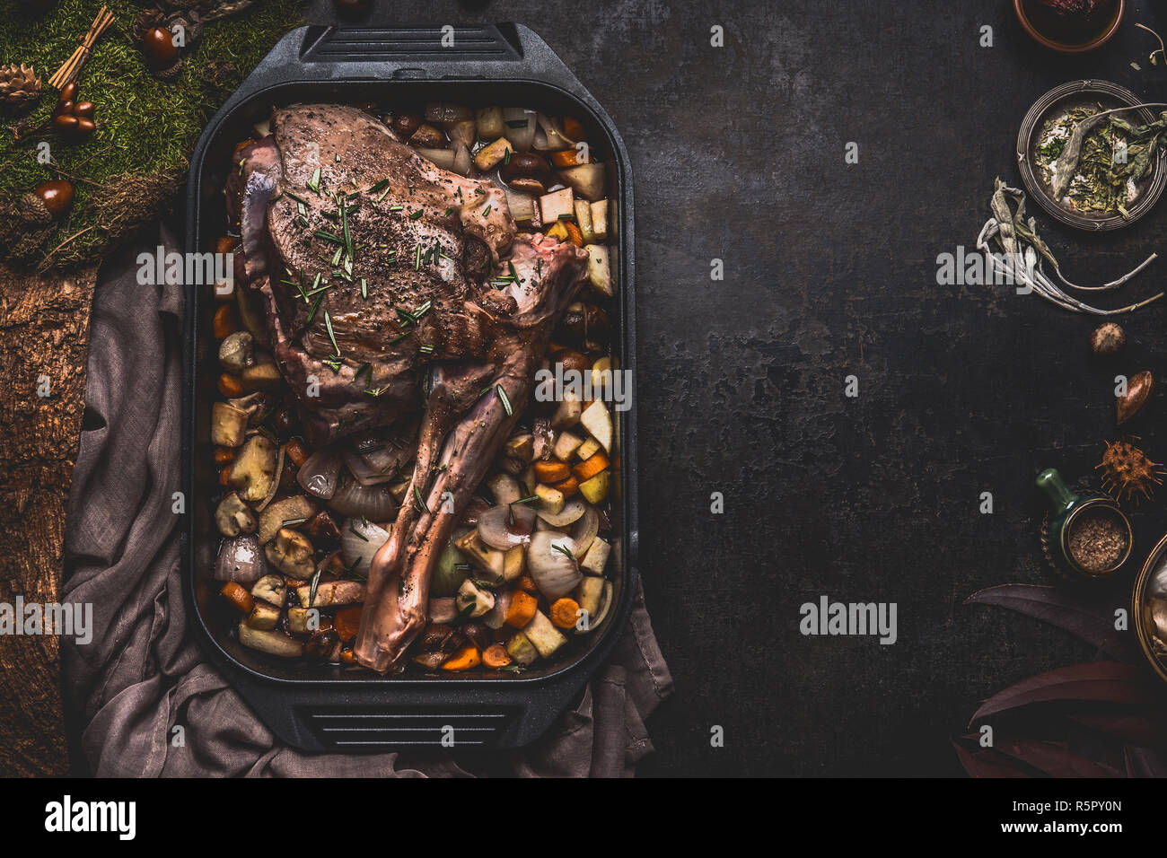 Cooking preparation of venison roast. Leg of deer with bone in cast