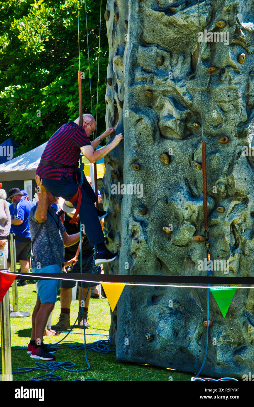 rock climbing for seniors with safety harness Stock Photo Alamy