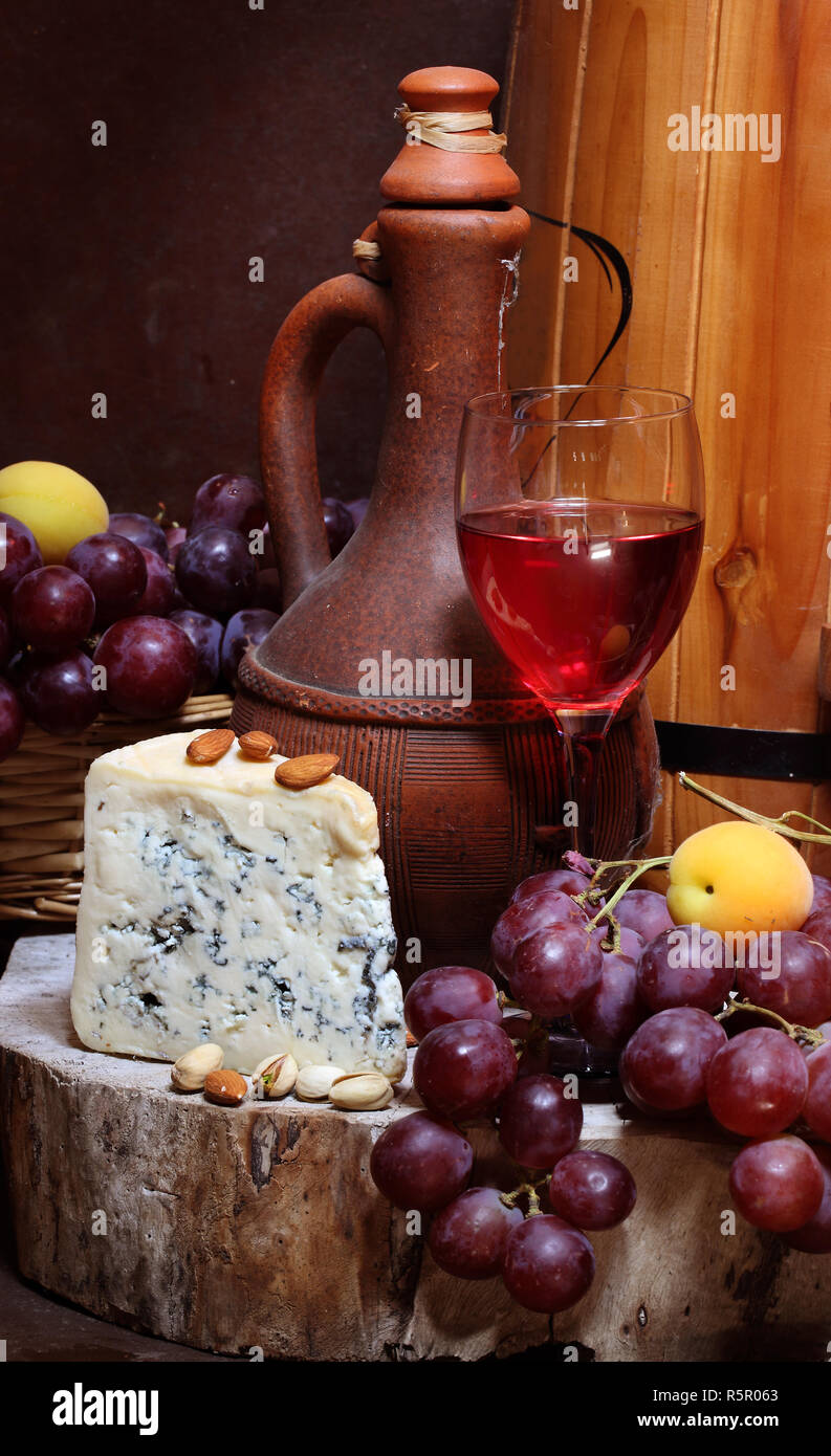 Still life with red wine and cheese Stock Photo - Alamy