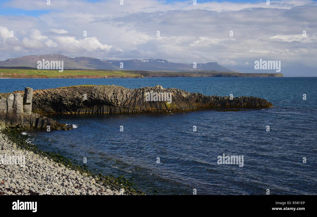 Icelandic landscape at Kalfshamarsvik on peninsula Skagi with basalt rocks and ocean. Stock Photo