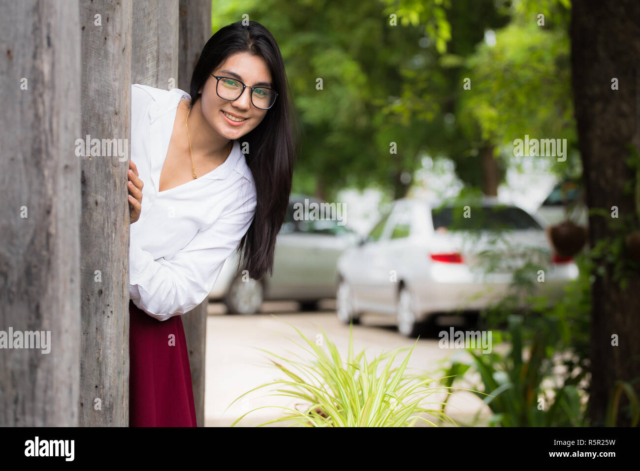 A portrait of a beautiful young asian woman in the park Stock Photo - Alamy