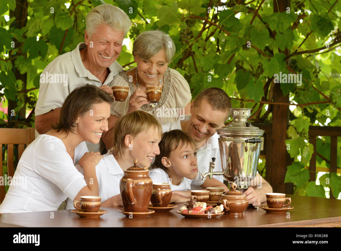 Happy family in summer hi-res stock photography and images - Alamy