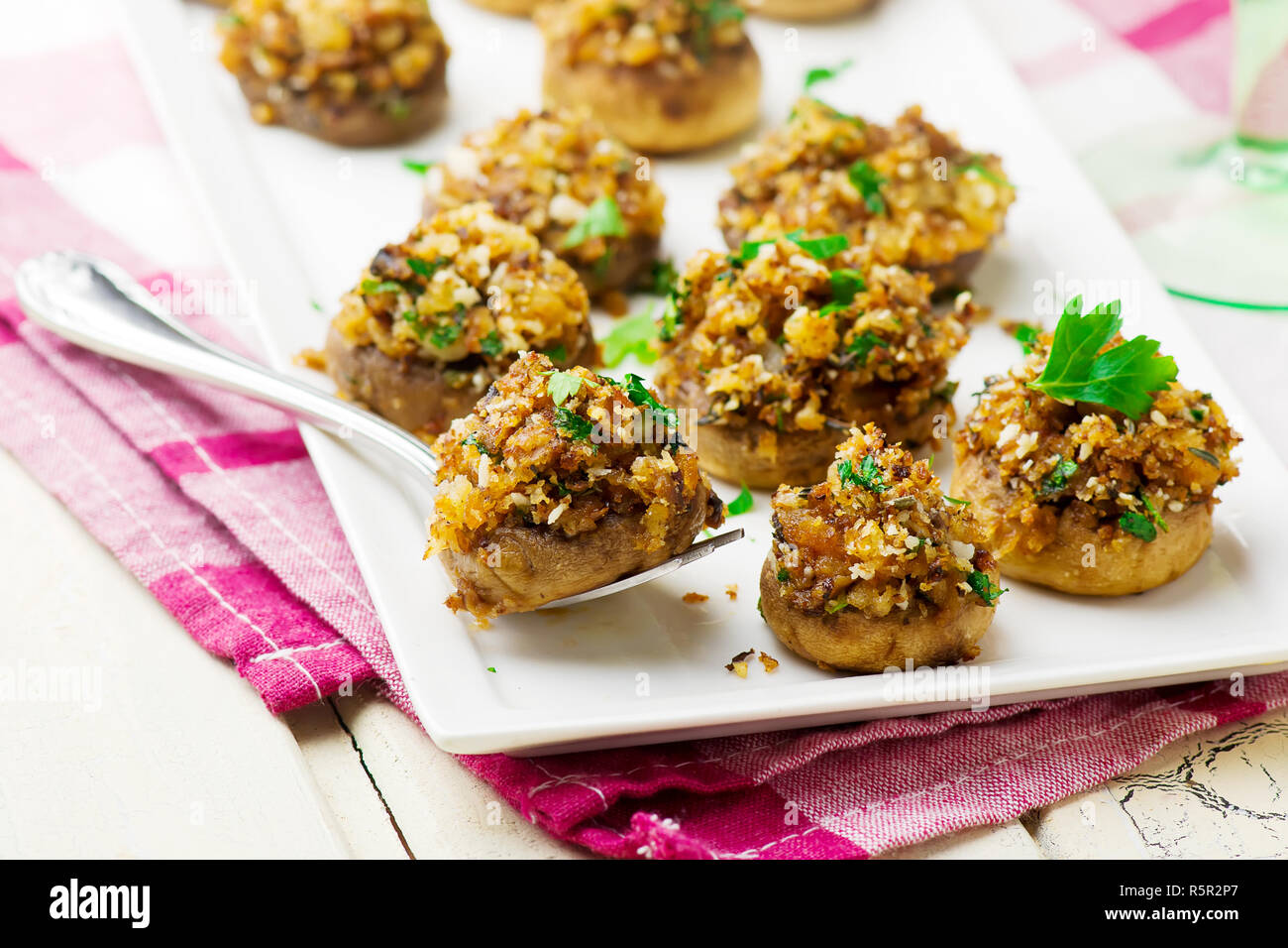 PANKO AND HERB STUFFED MUSHROOMS.Holiday table. selective focus Stock