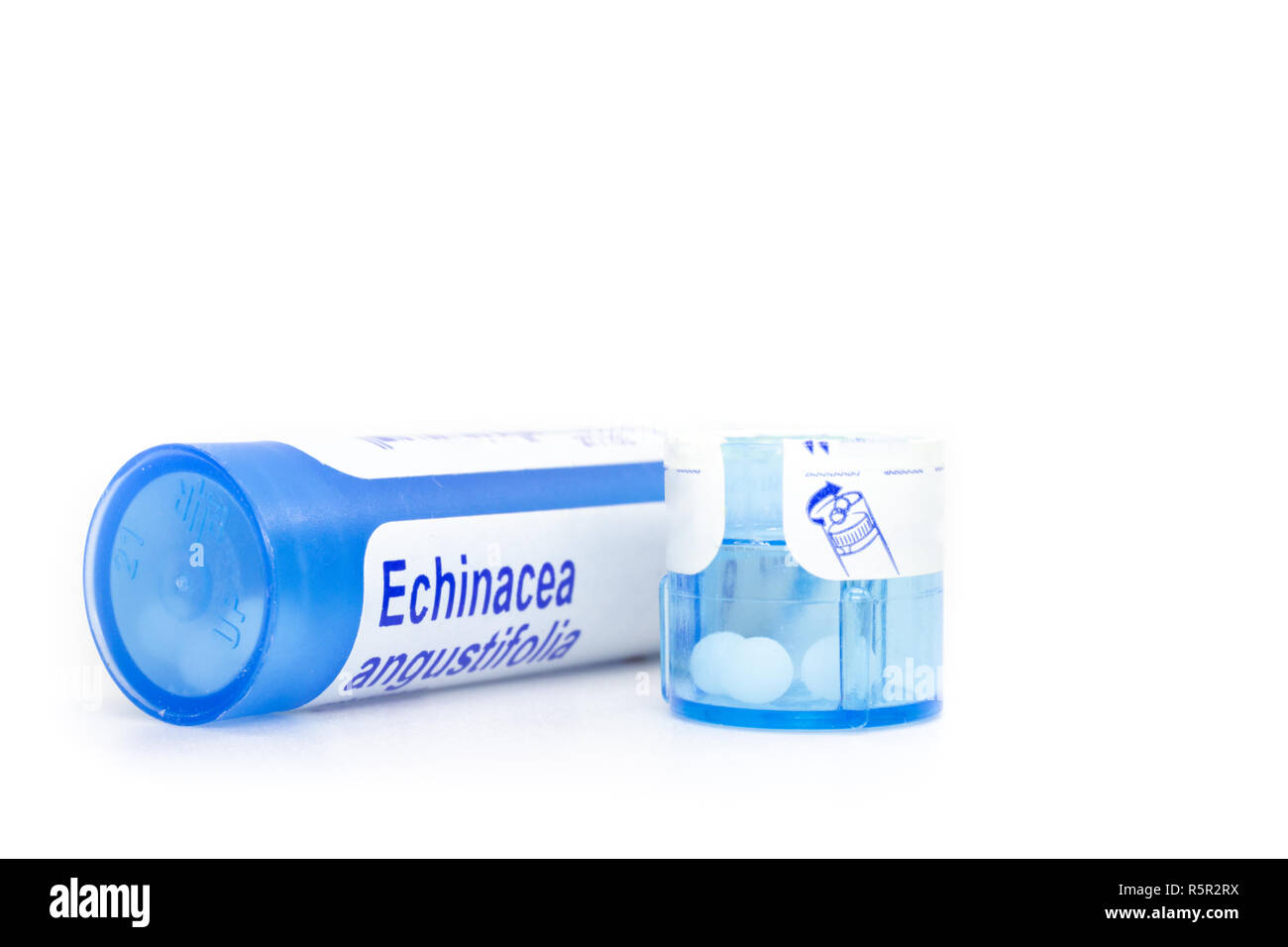 Homeopathic medicine. A blue plastic tube containing small balls of Echinacea angustifolia. Stock Photo