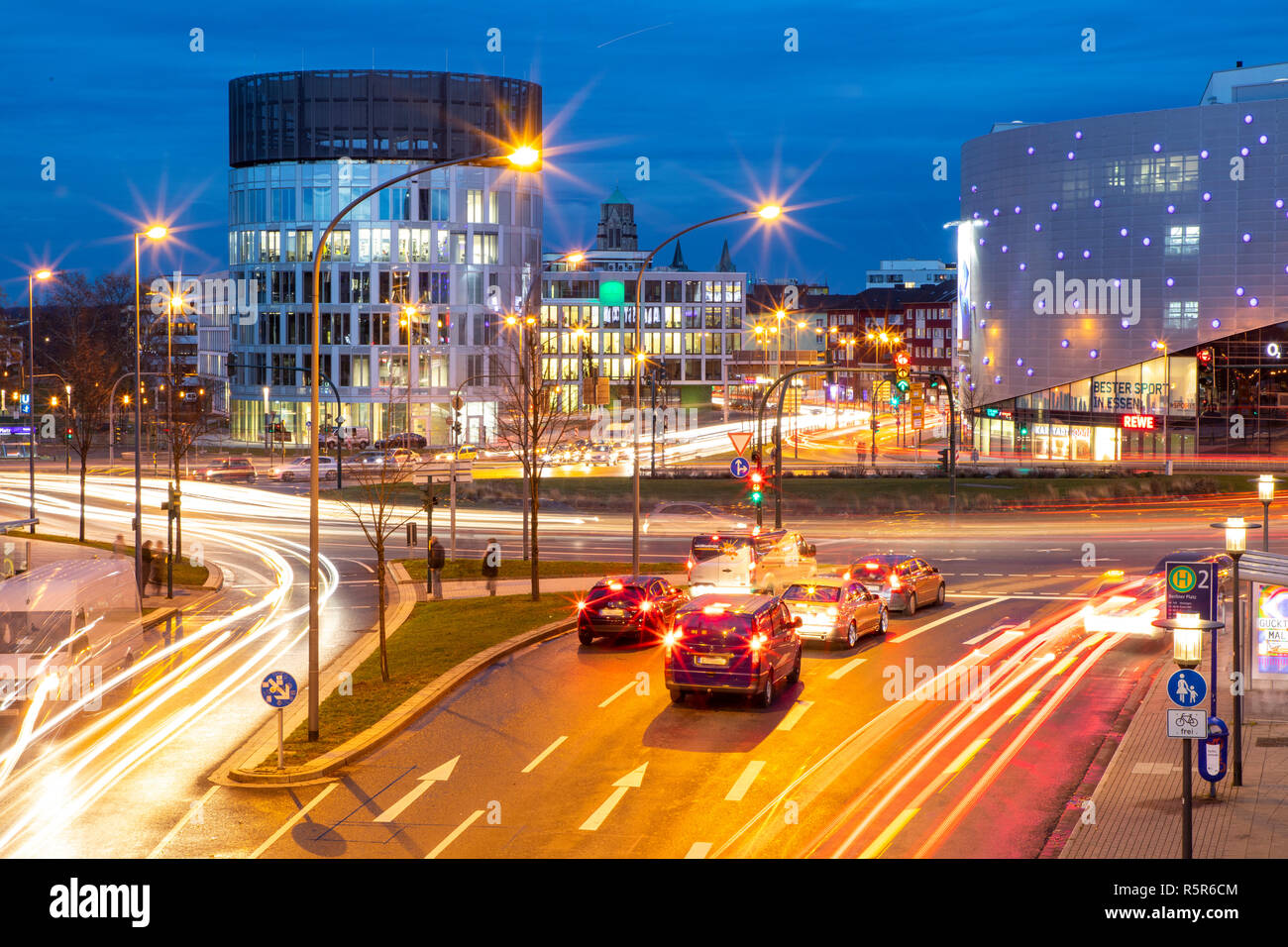 Evening city traffic in Essen, Germany, large intersection, roundabout