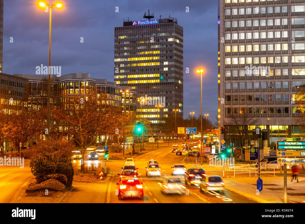 Evening city traffic in Essen, Germany, large intersection, Bismarck Square,  this area would also be affected by a diesel driving ban, Stock Photo