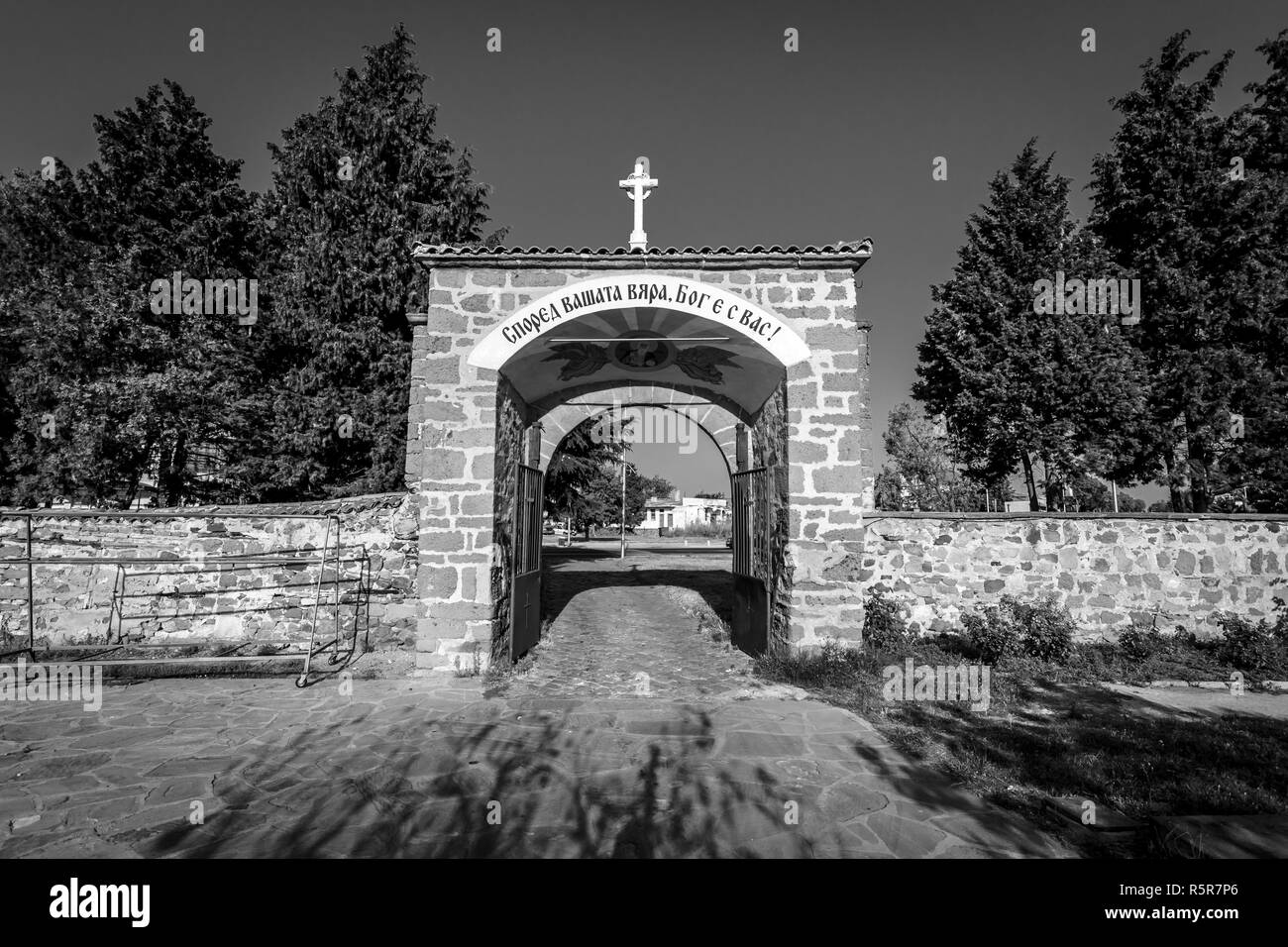 Entrance stone gate to the Monastery of St. George in Pomorie. Bulgaria. Black and white. Stock Photo