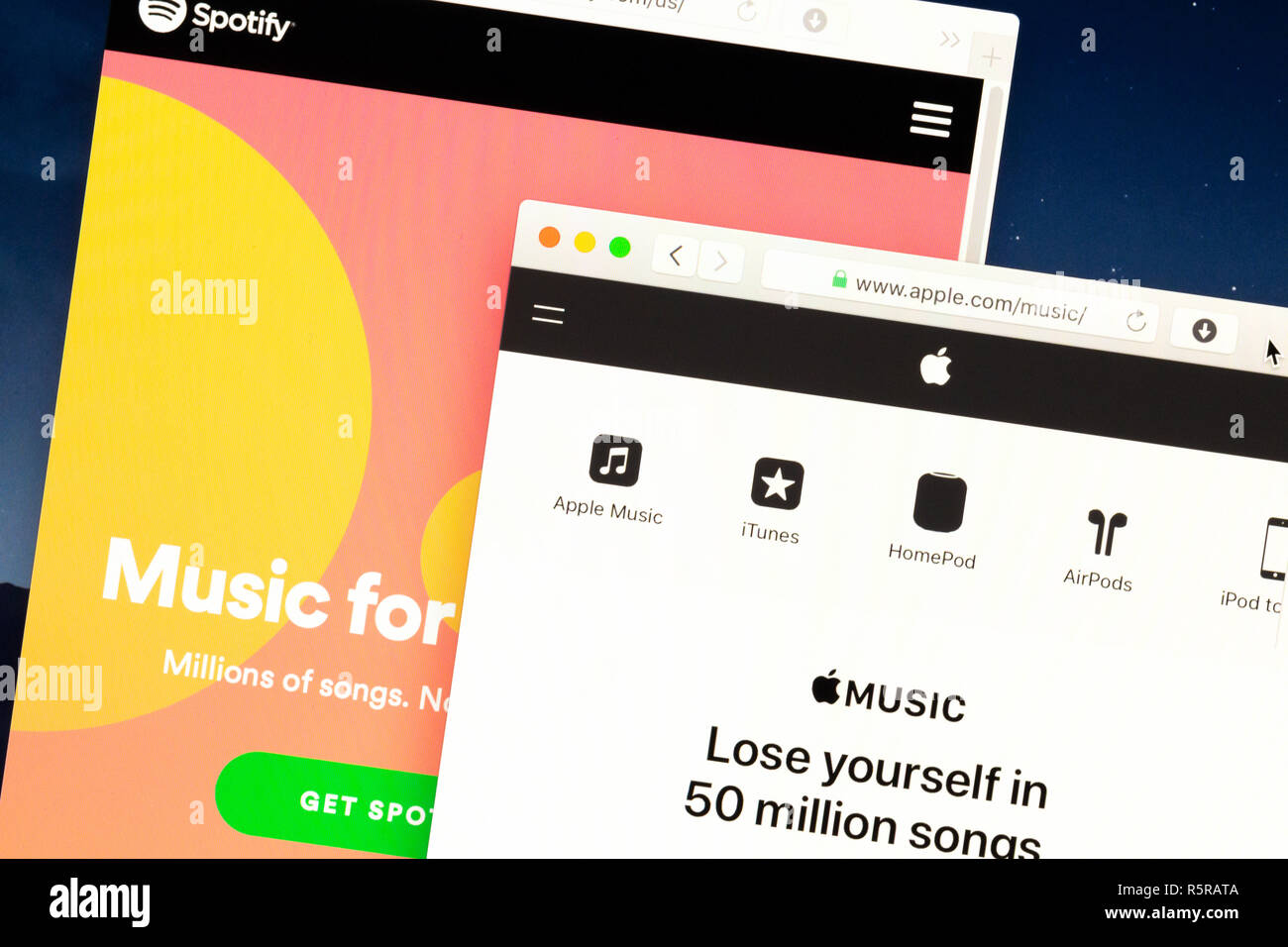 November 28, 2018: Homepages of Spotify and Apple Music on screen Stock Photo