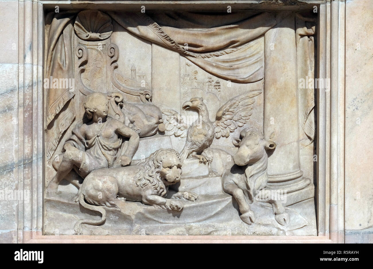 Throne of God and Four Living Creatures, marble relief on the facade of the Milan Cathedral, Duomo di Santa Maria Nascente, Milan, Lombardy, Italy Stock Photo