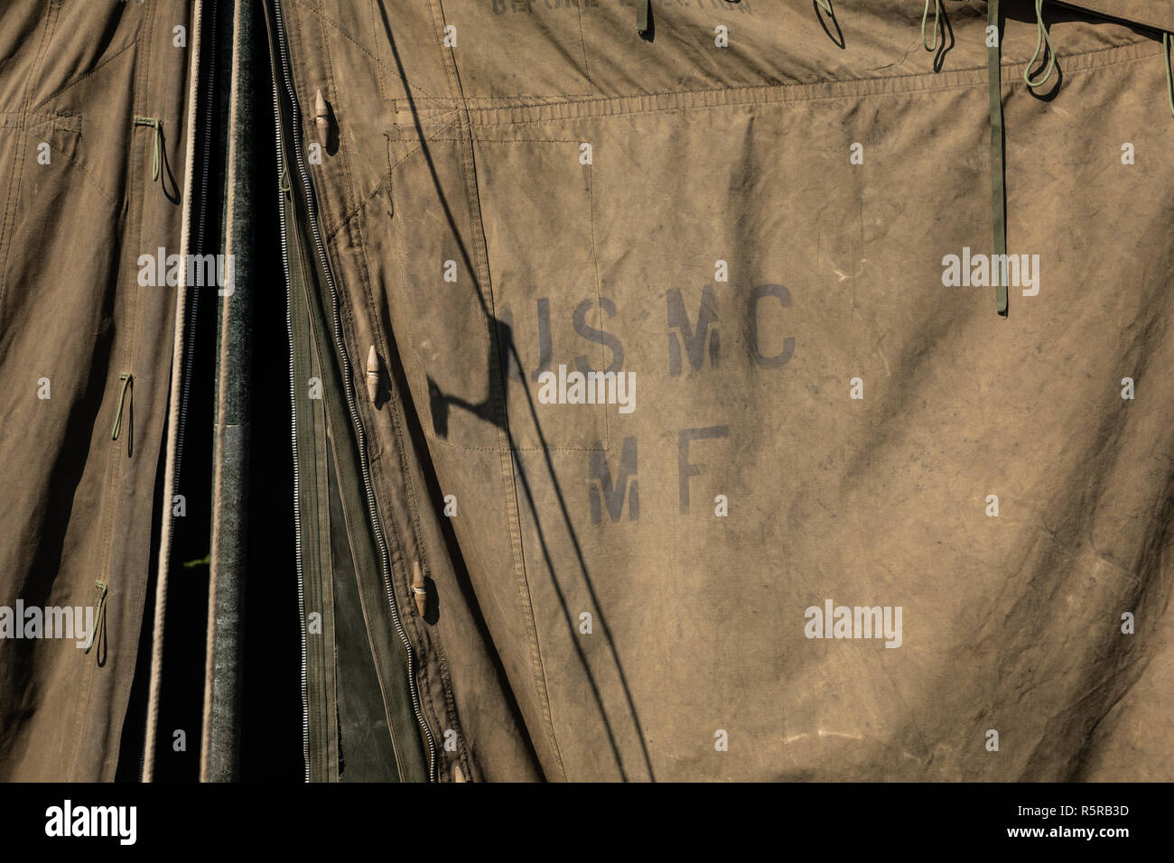 Green military tent with USMC initials (United States Marine Corps) Stock Photo