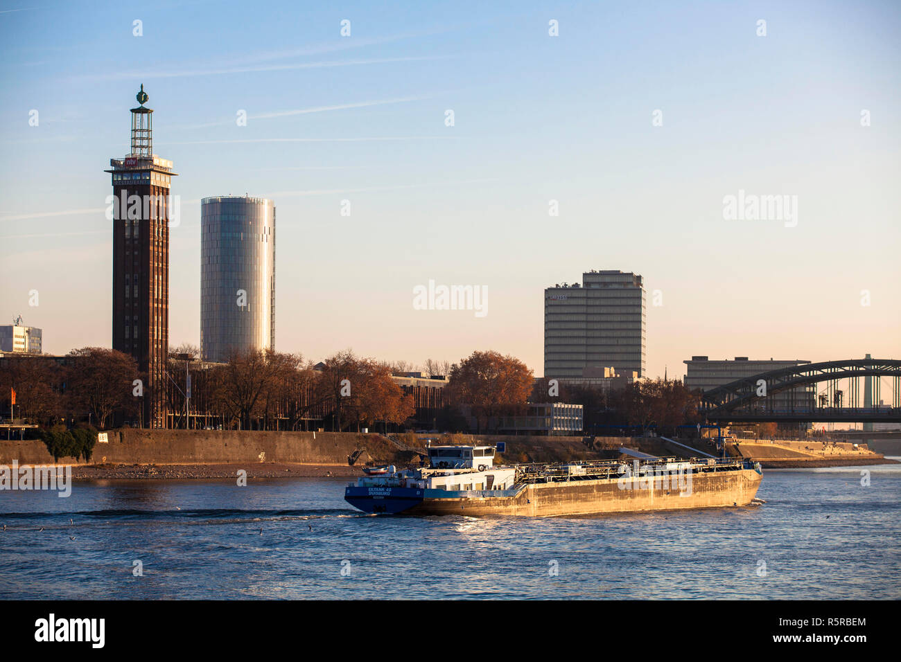 view across the river Rhine to the old tower of the former exhibition center, the Cologne Triangle Tower and the Lanxess Tower in the district Deutz,  Stock Photo