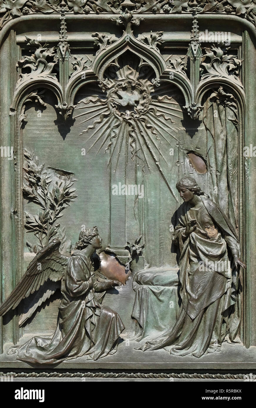 Annunciation to the Virgin Mary, detail of the main bronze door of the Milan Cathedral, Duomo di Santa Maria Nascente, Milan, Lombardy, Italy Stock Photo