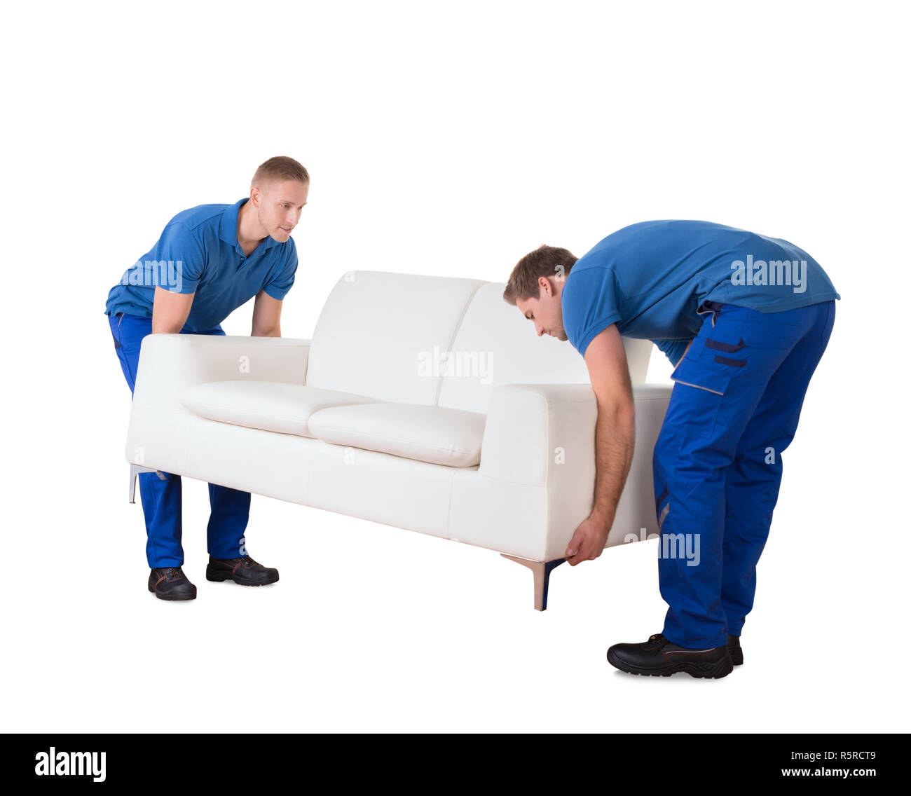 Two men moving furniture apartment Cut Out Stock Images & Pictures - Alamy