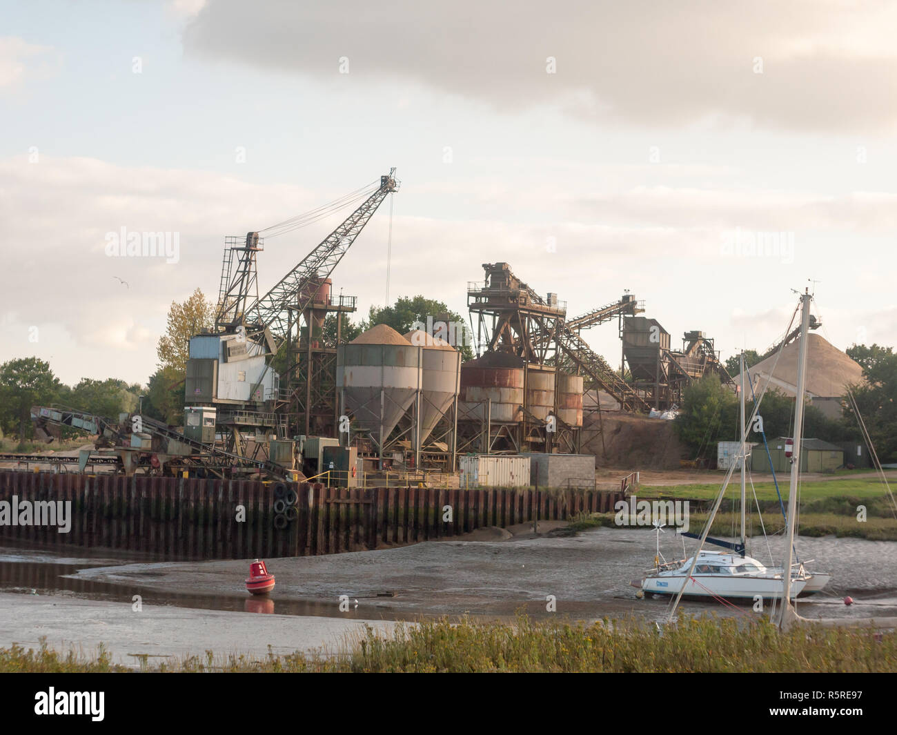 sand industry materials quarry dock factory across river Stock Photo
