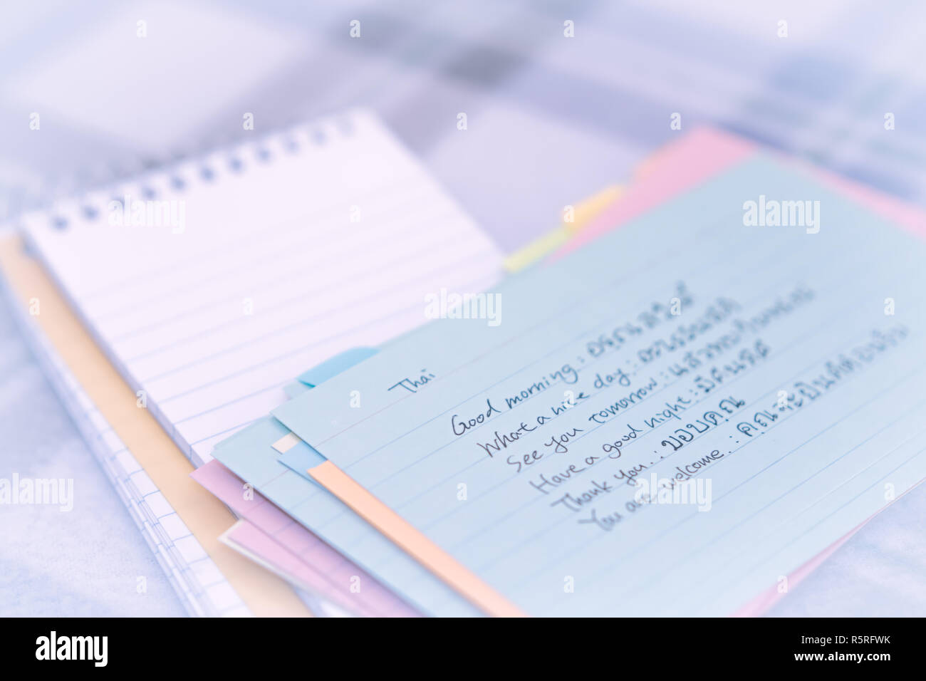 Thai  Learning New Language Writing Greetings on the Notebook Stock Photo