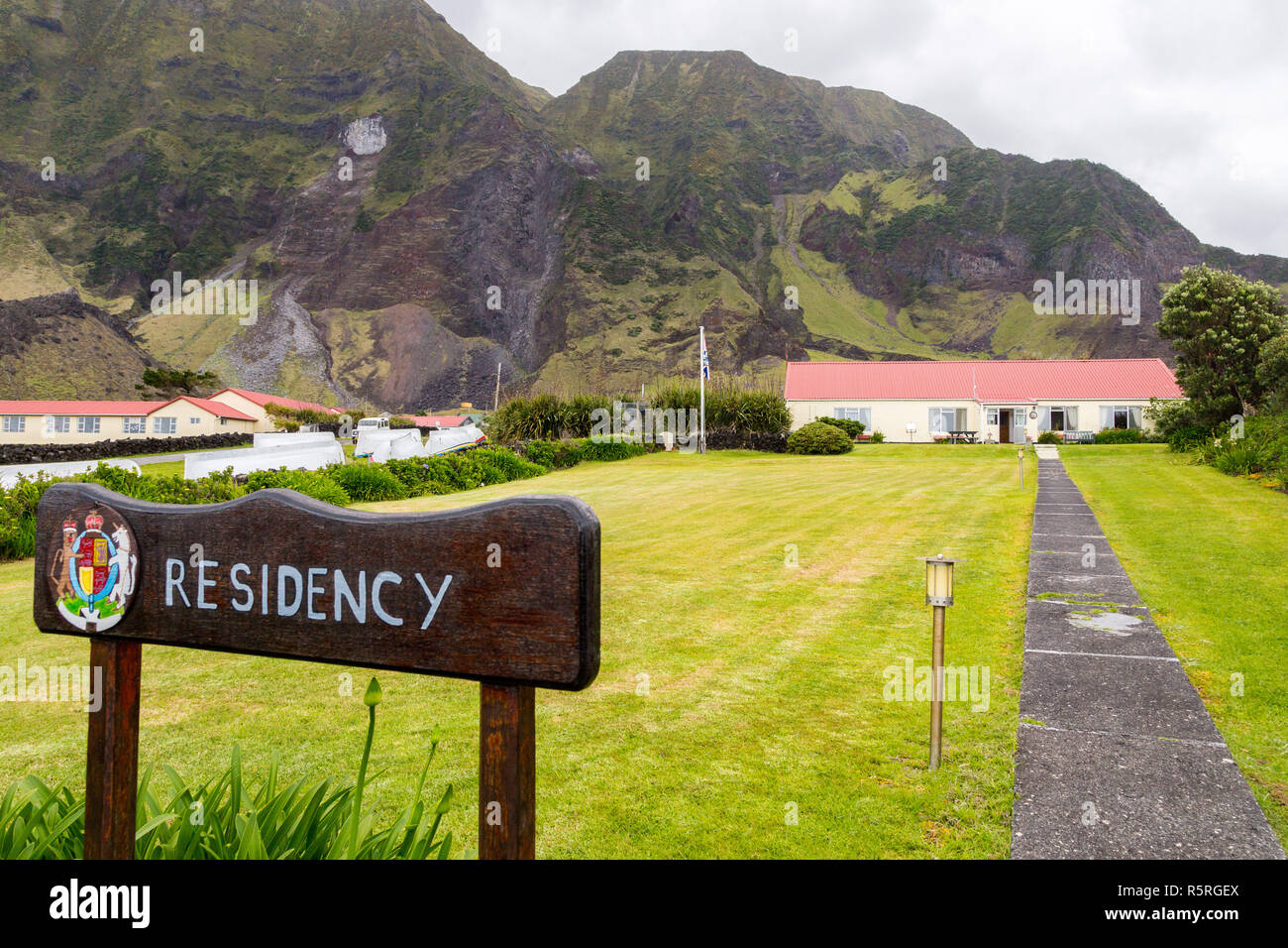 View of British Governor residency, signpost, coat of arms. Edinburgh of the Seven Seas town, Tristan da Cunha, the most remote inhabited island, Sout Stock Photo