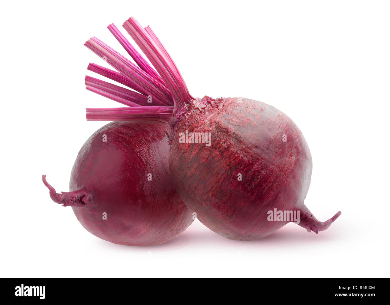 Isolated vegetables. Two whole raw beetroots isolated on white background with clipping path Stock Photo