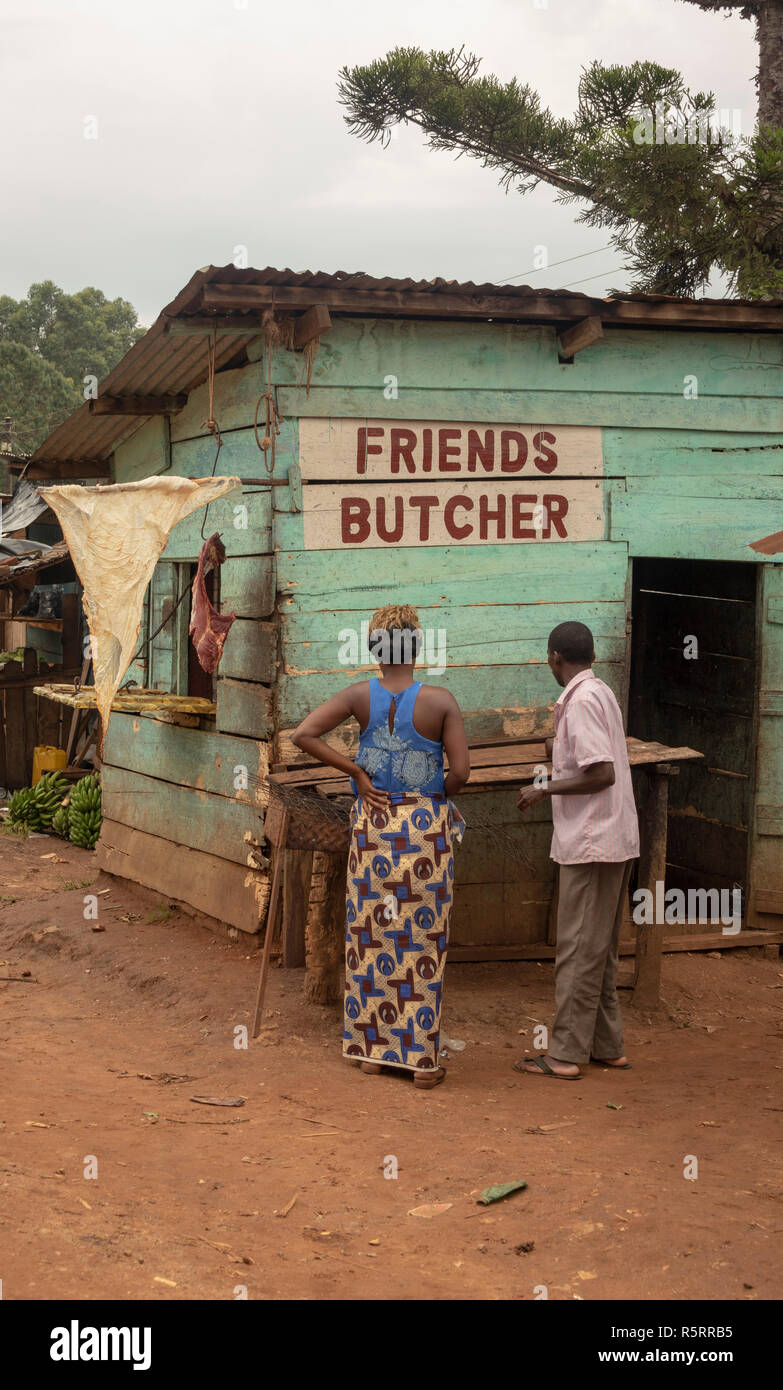 woman buying meat at Friends Butcher stall at Bigodi, Western Uganda, Africa Stock Photo