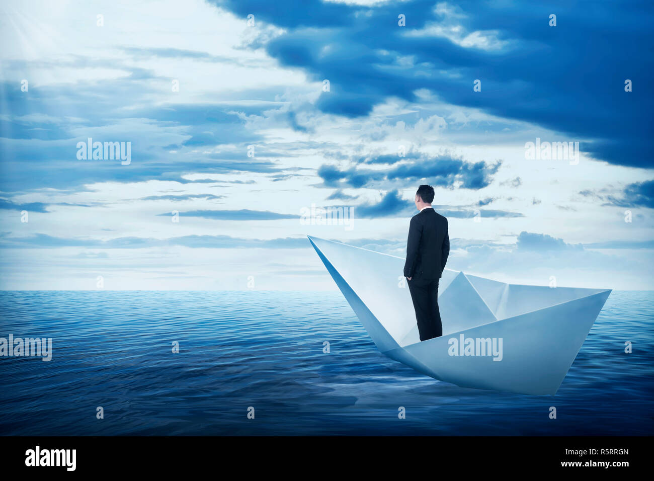 Asian business man standing on the boat Stock Photo - Alamy