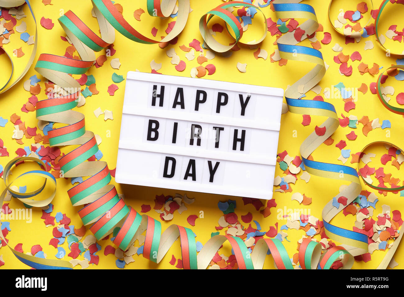happy birthday party flat lay with confetti and streamers Stock Photo