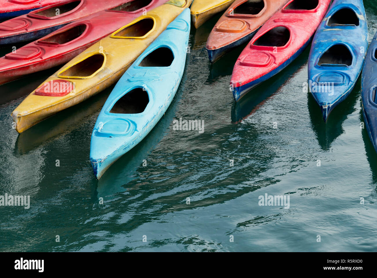 Colourful kayaks in the sea in Ha Long Bay, Vietnam Stock Photo