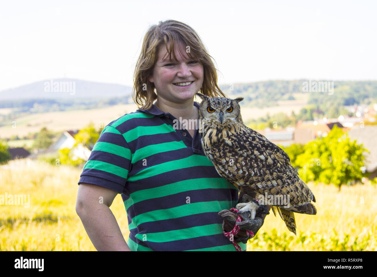 young woman with eagle owl Stock Photo