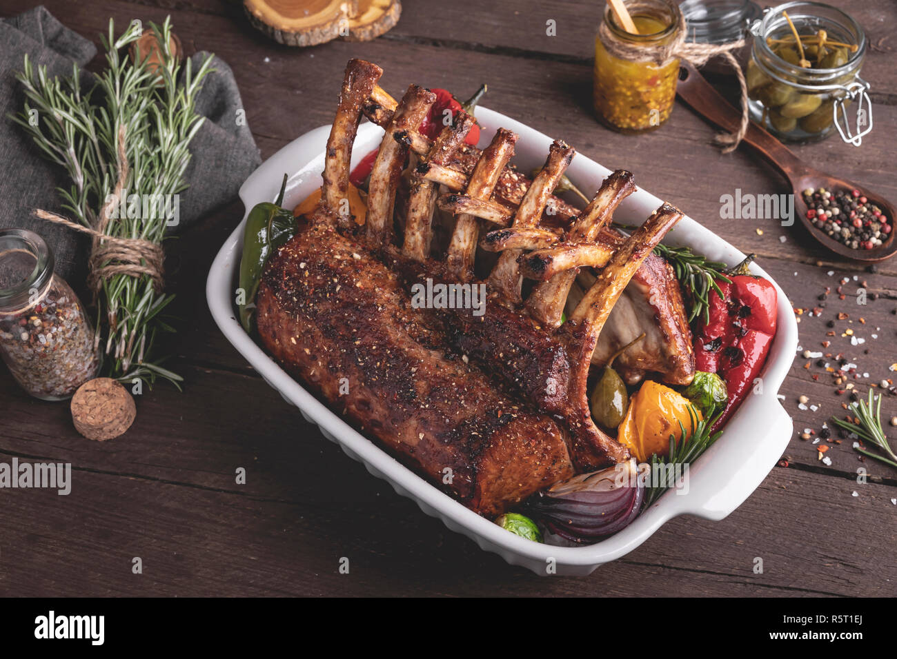 Veal Rack Chops Grilled roasted rack of veal lamb chops with vegetables in ceramic ...