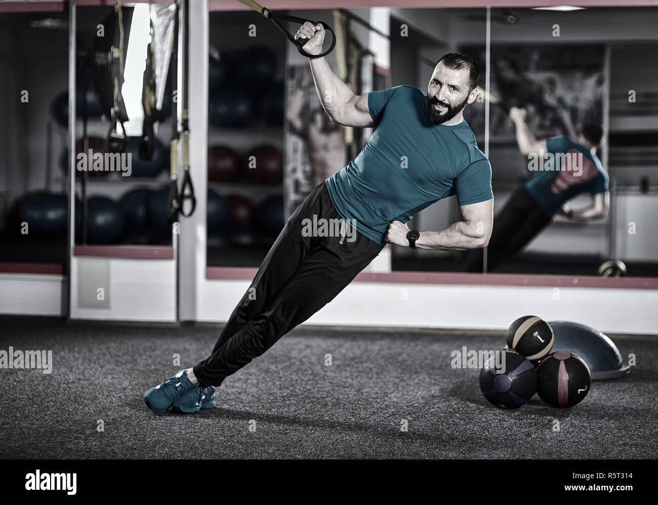 Fitness trainer working with trx straps for crossfit workout Stock ...