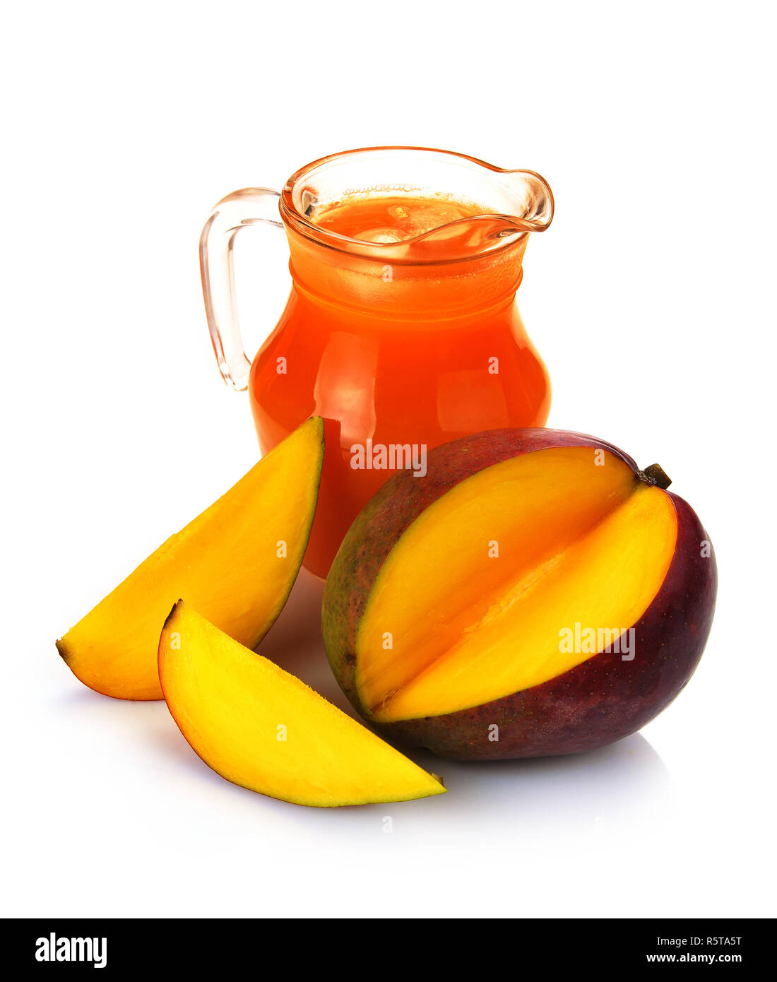 mango juice in a jug and a glass of fruit Stock Photo Alamy