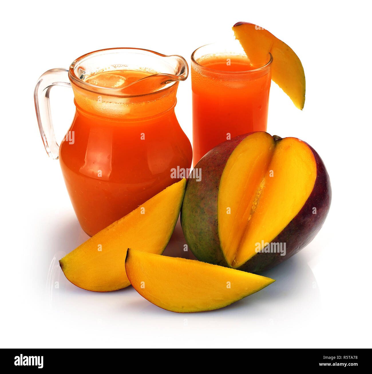 mango juice in a jug and a glass of fruit Stock Photo Alamy
