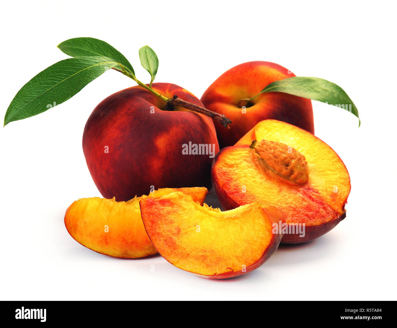 Fresh peach with green leaf isolated on white background. Peach in a