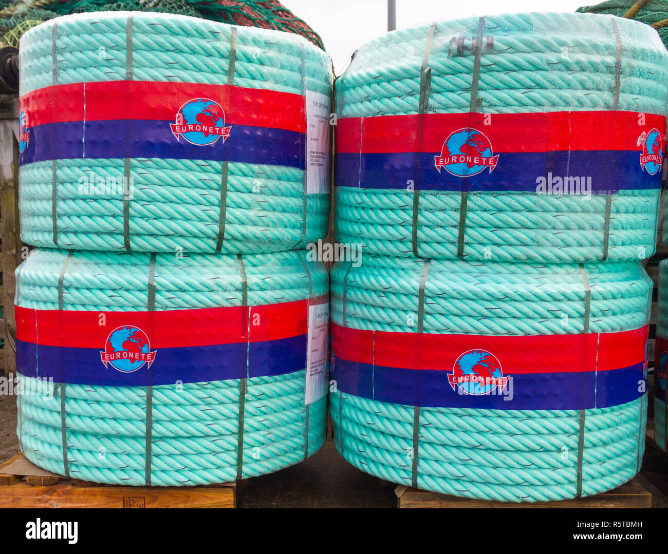 220 Metre Coils of nylon rope on pallets used for making trawl gear for trawlers. Stock Photo