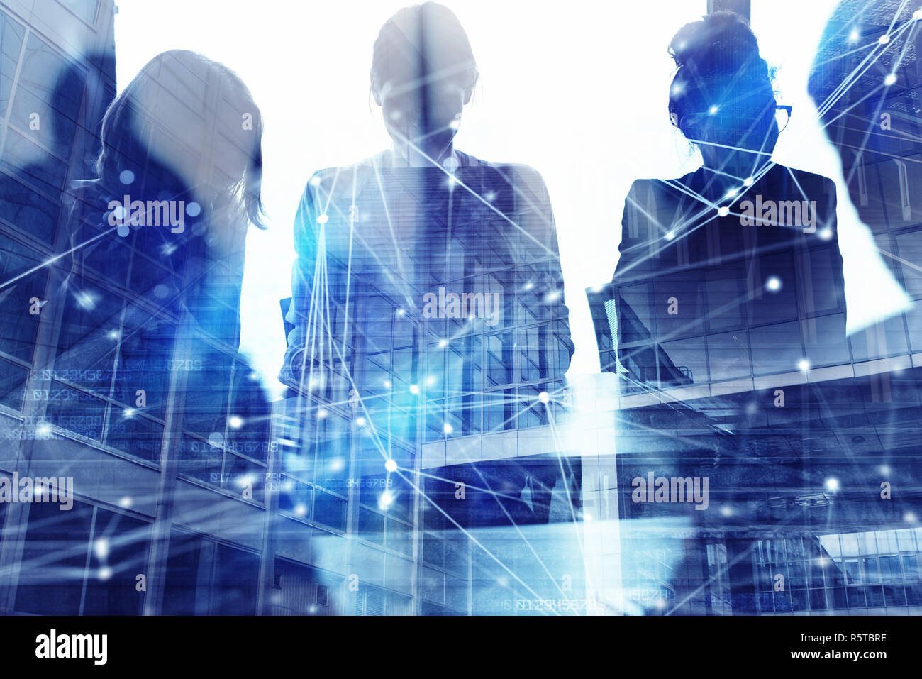 Silhouette of business people working together in office. Concept of teamwork and partnership. double exposure with network effects Stock Photo