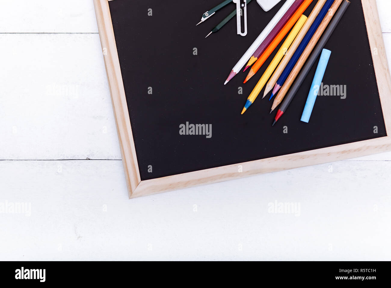 Back To School Concept Colored Pencils On Black Table