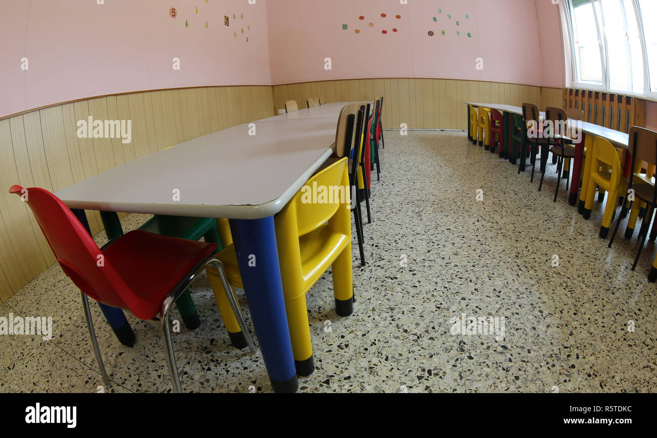 small seats and tables in a refectory of the nursery canteen Stock Photo