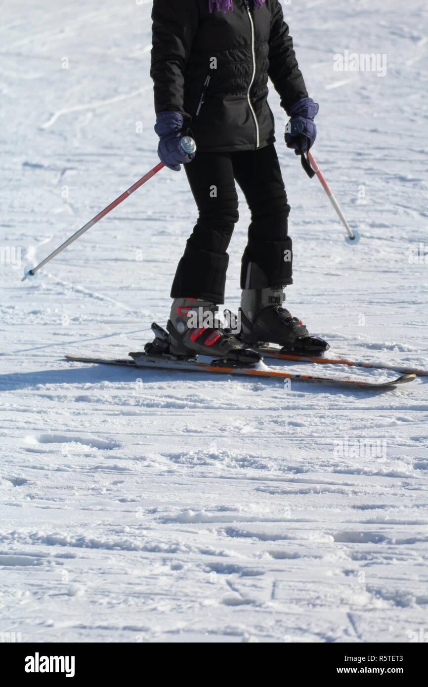 a ski athlete arrives at the end of the descent Stock Photo