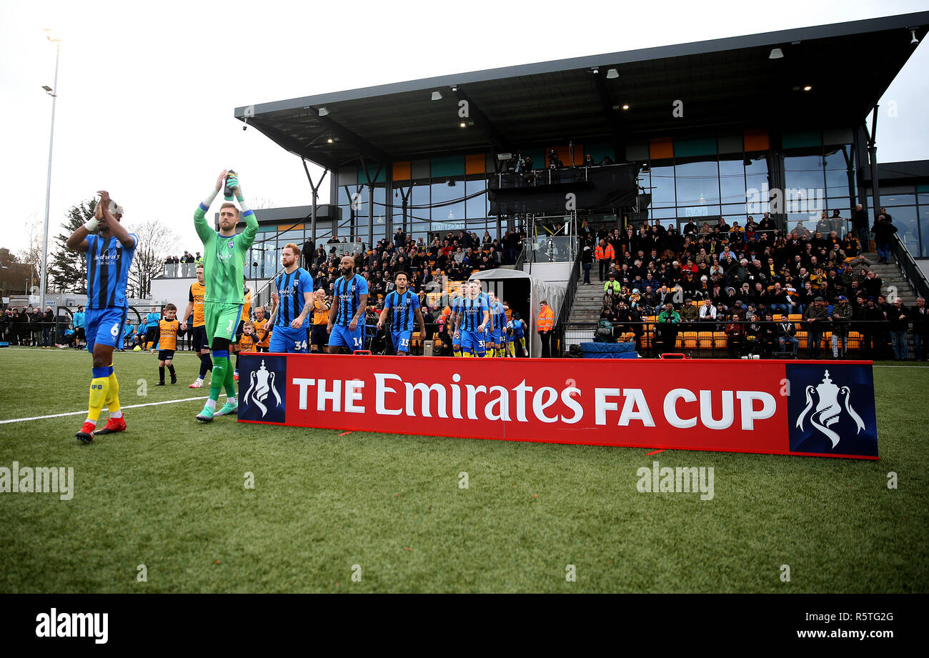 Slough Town and Gillingham players walk out during the Emirates FA Cup, Second Round match at Arbour Park, Slough. Stock Photo