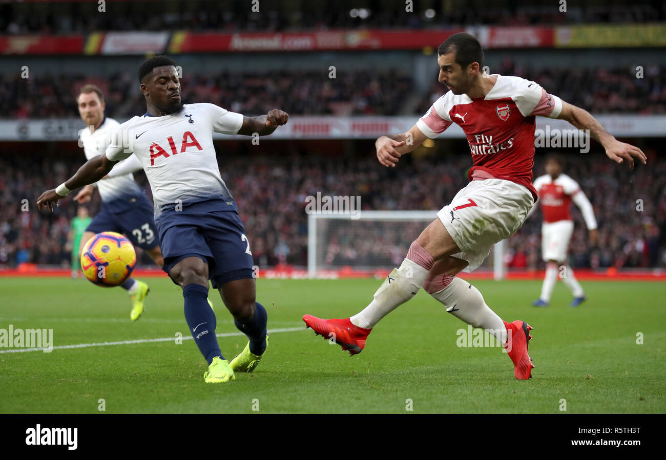 Tottenham Hotspur's Serge Aurier (left) and Arsenal's Henrikh Mkhitaryan battle for the ball during the Premier League match at Emirates Stadium, London. Stock Photo