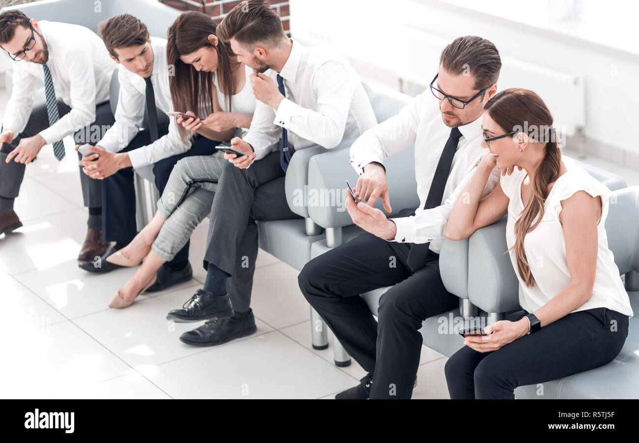 business team sitting in the lobby of the business cente Stock Photo ...