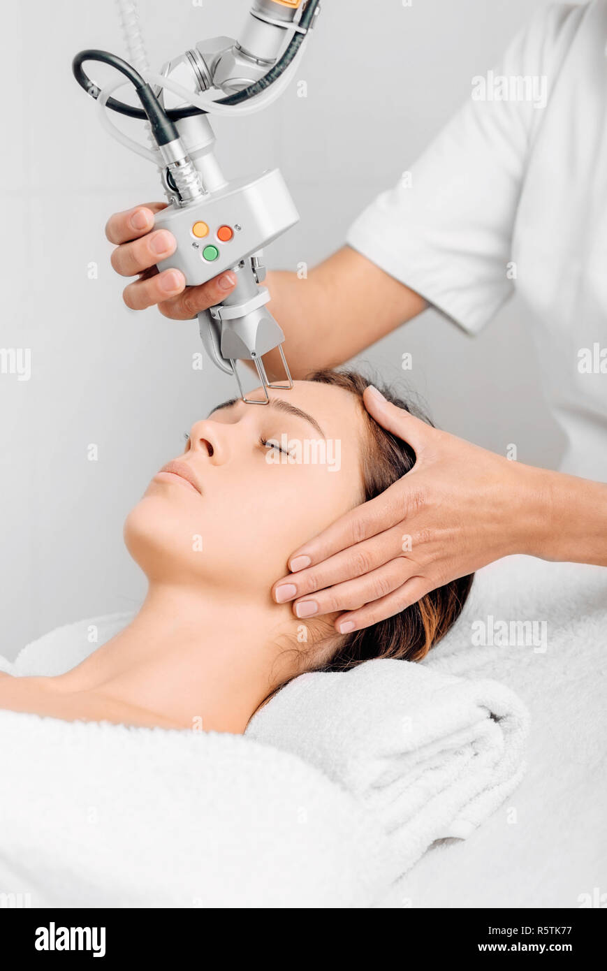woman getting laser facial treatment, aesthetic surgery Stock Photo Alamy