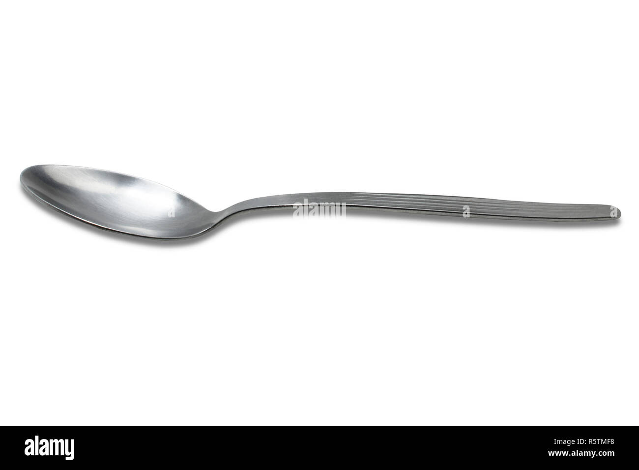 Clean shiny metal spoon isolated on white. Stainless steel small