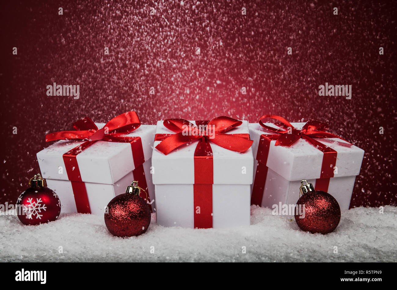White gift boxes and on red background with copy space Stock Photo - Alamy