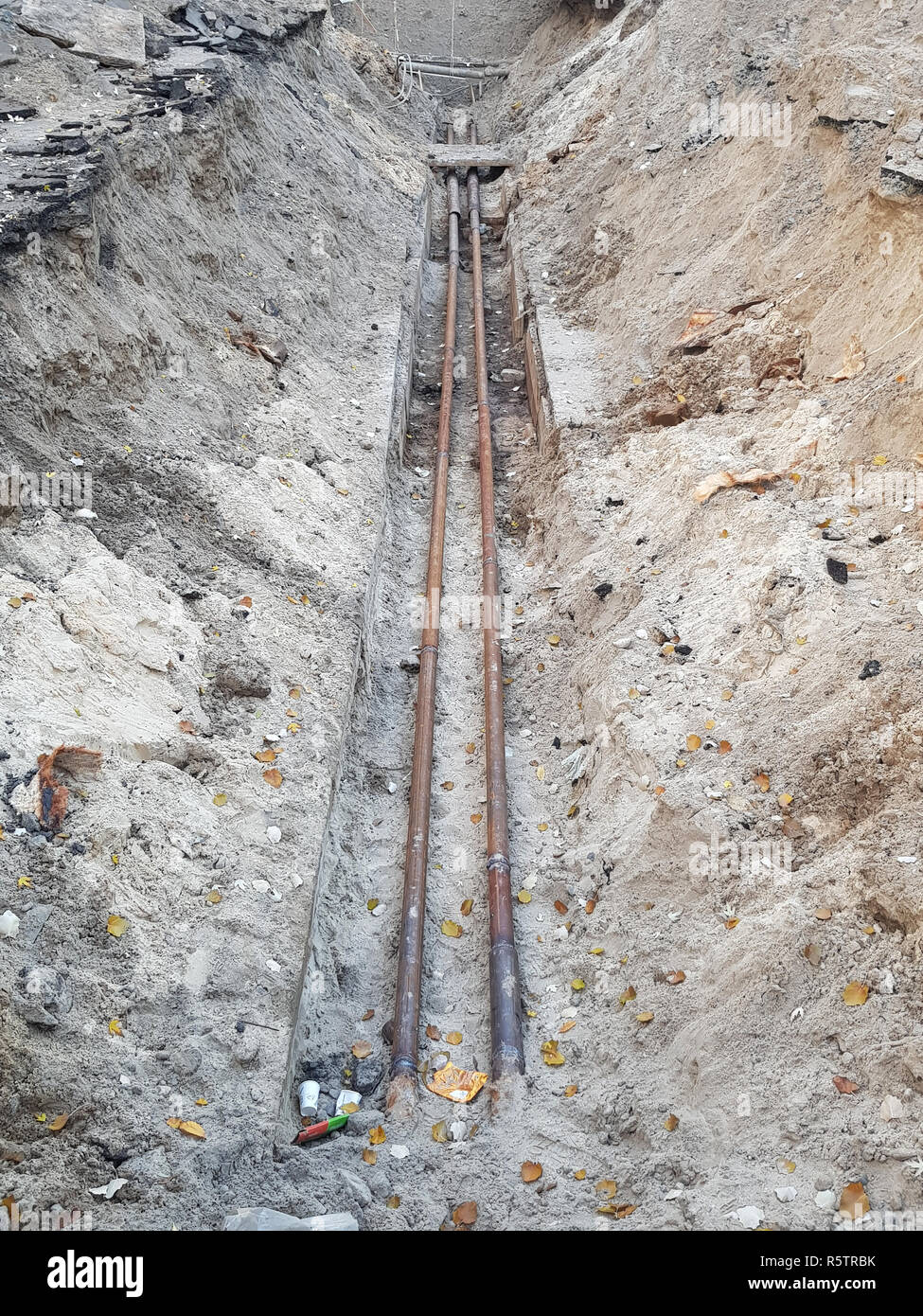 repair of water pipes. dug water pipes in a deep trench in the ground